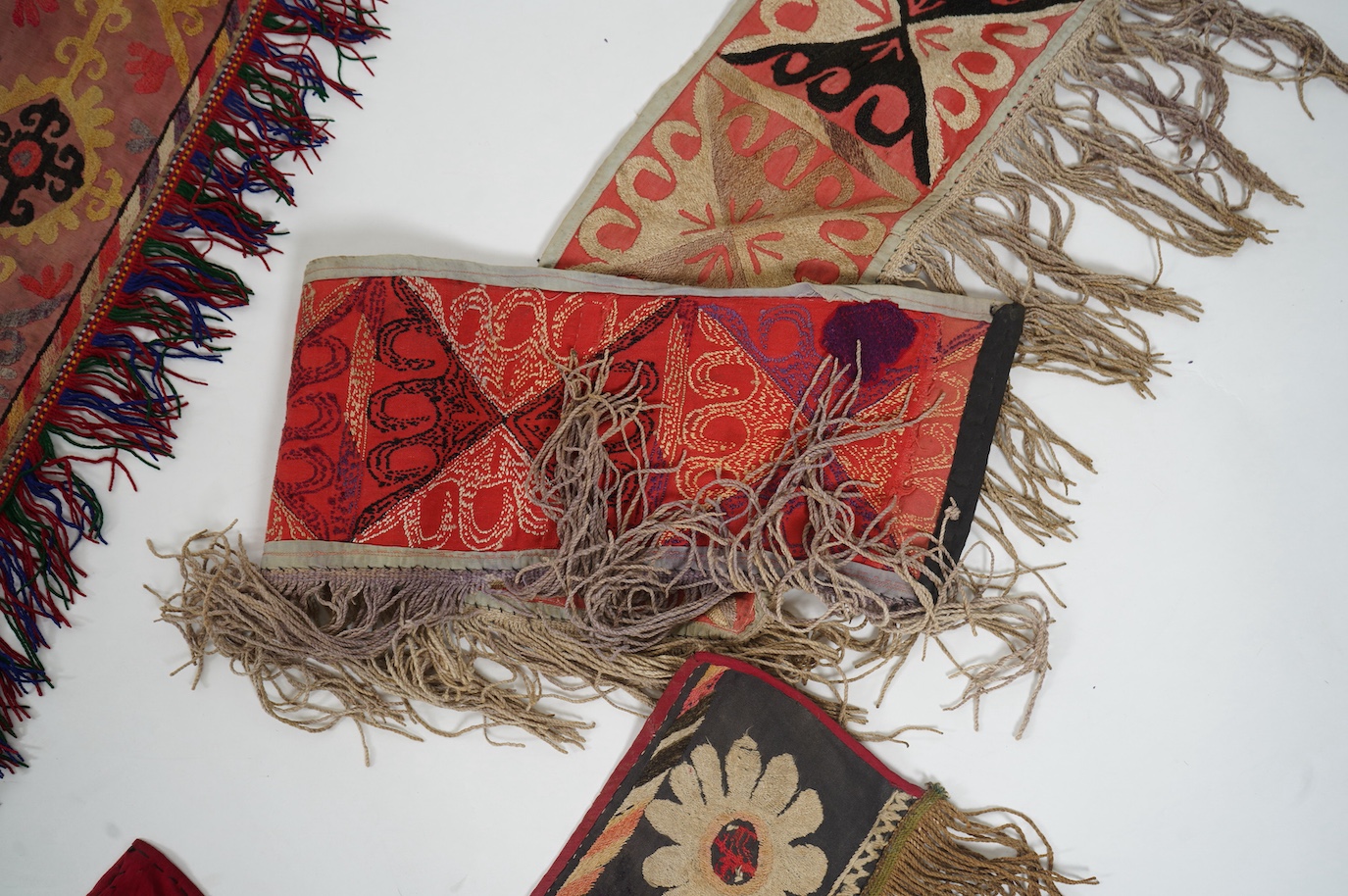 Five various sized late 19th / early 20th century Usbek Saye Gosha (V shaped) Suzani silk embroidered bridal yurt wall hangings, usually forming part of a dowry, two with later fringing, longest 172cm. Condition - some f